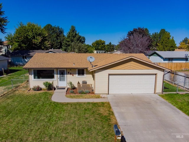 ranch-style house with a garage and a front lawn