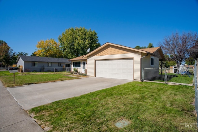 ranch-style house featuring a garage and a front lawn