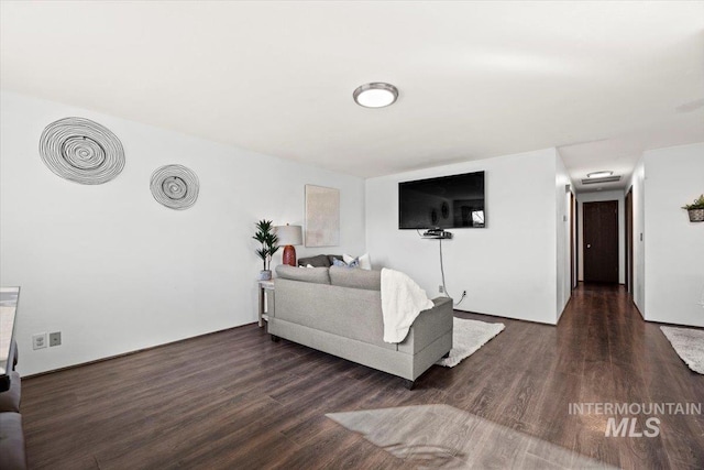 living room with dark wood-type flooring