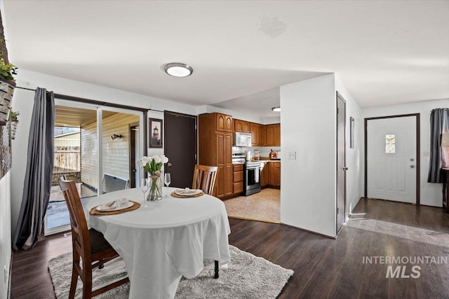 dining room with dark hardwood / wood-style floors