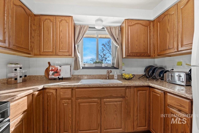 kitchen with sink and backsplash