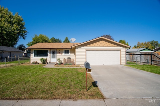 ranch-style house featuring a front yard and a garage