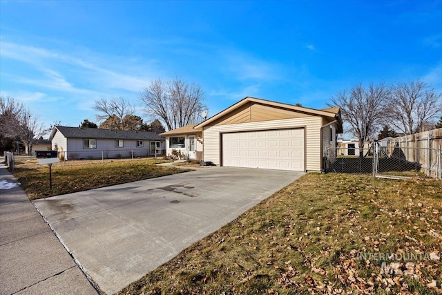 ranch-style home featuring a garage and a front lawn