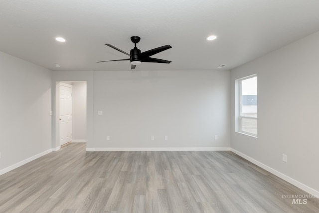 empty room featuring light wood-type flooring, baseboards, ceiling fan, and recessed lighting