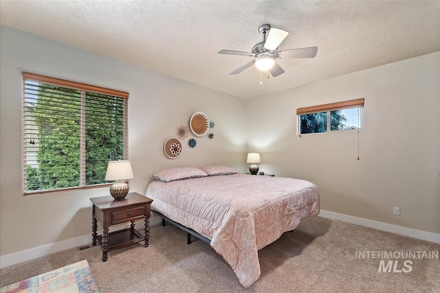 2479 N Devlin Ave, Meridian, ID 83646 - bedroom featuring baseboards, light carpet, and ceiling fan