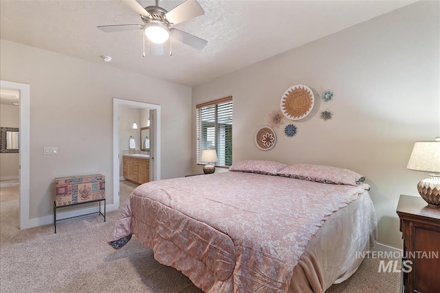 2479 N Devlin Ave, Meridian, ID 83646 - bedroom featuring light carpet, ensuite bath, baseboards, and a ceiling fan
