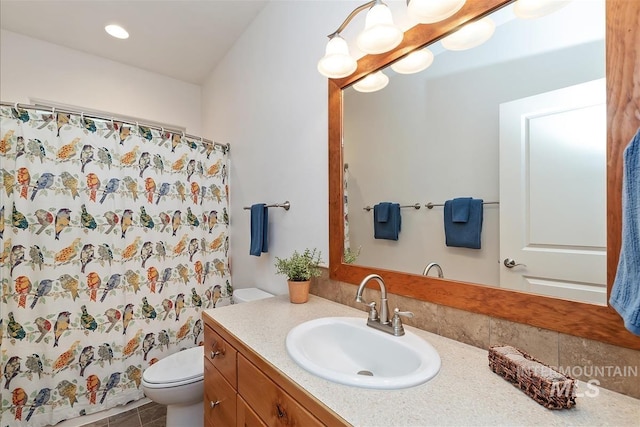 2479 N Devlin Ave, Meridian, ID 83646 - bathroom with vanity, toilet, a shower with shower curtain, and recessed lighting