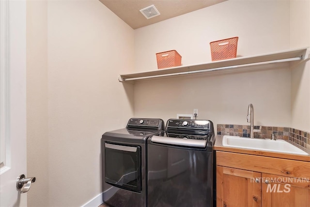 2479 N Devlin Ave, Meridian, ID 83646 - laundry area featuring independent washer and dryer and cabinet space
