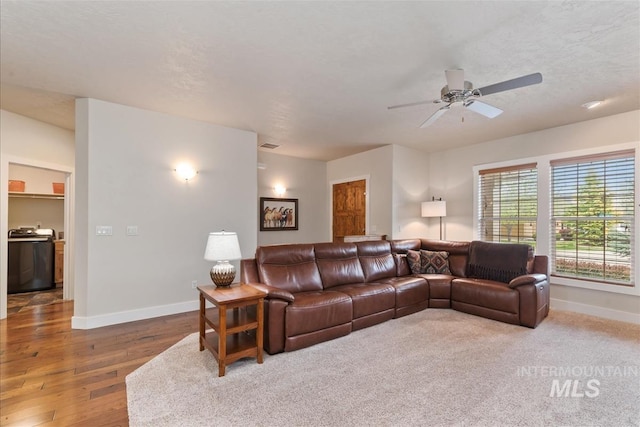 2479 N Devlin Ave, Meridian, ID 83646 - living area featuring baseboards, a ceiling fan, and hardwood / wood-style flooring