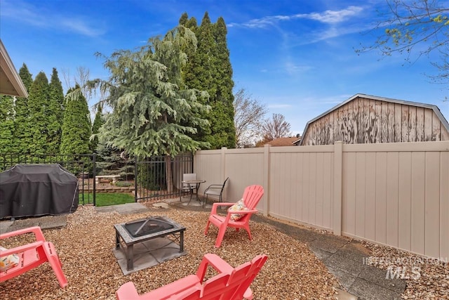 2479 N Devlin Ave, Meridian, ID 83646 - fenced backyard featuring a fire pit