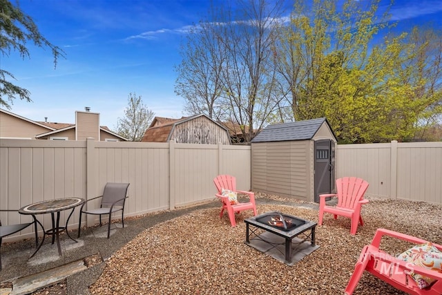 2479 N Devlin Ave, Meridian, ID 83646 - fenced backyard with a fire pit and a patio area