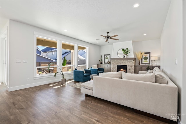 6086 S Sachet Ave, Meridian, ID 83642 - living area with ceiling fan, a fireplace, recessed lighting, baseboards, and dark wood-style floors