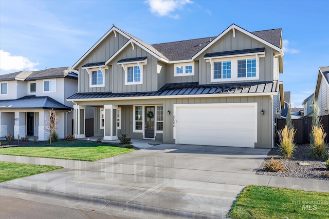 6086 S Sachet Ave, Meridian, ID 83642 - view of front facade featuring a standing seam roof, board and batten siding, and driveway