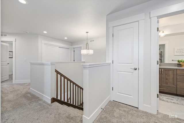 6086 S Sachet Ave, Meridian, ID 83642 - corridor featuring carpet floors, baseboards, recessed lighting, and an upstairs landing