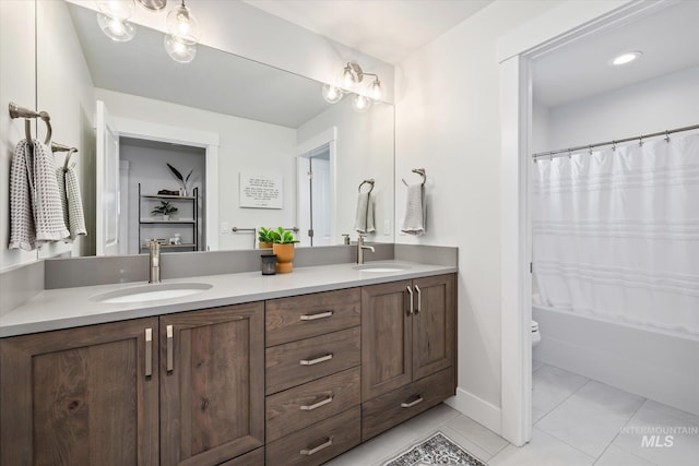 6086 S Sachet Ave, Meridian, ID 83642 - full bathroom with baseboards, double vanity, toilet, and a sink