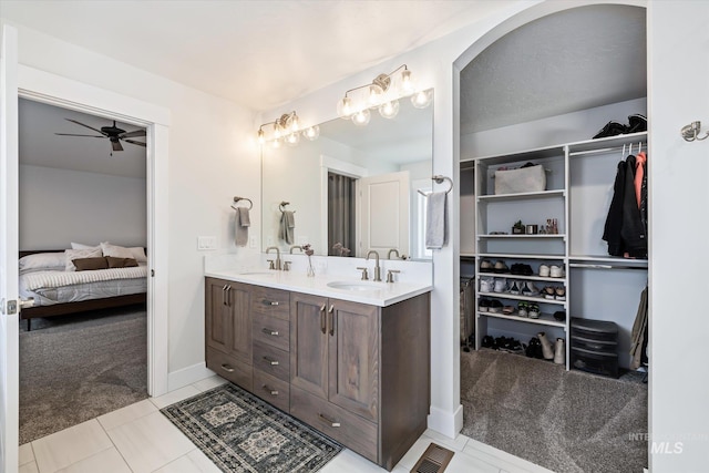 6086 S Sachet Ave, Meridian, ID 83642 - full bath featuring double vanity, a sink, a ceiling fan, and a walk in closet