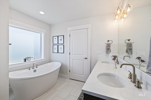 6086 S Sachet Ave, Meridian, ID 83642 - full bath featuring double vanity, a soaking tub, and a sink