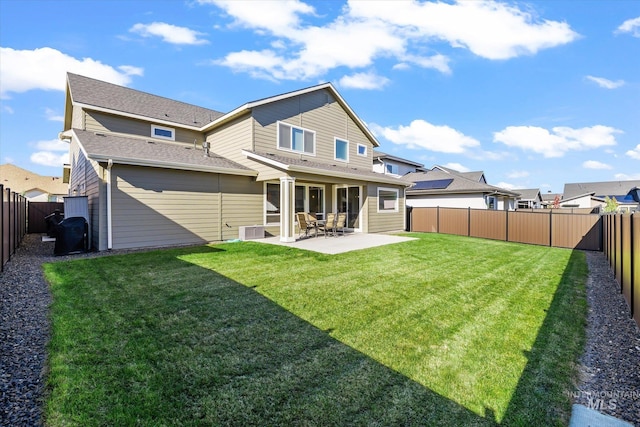 6086 S Sachet Ave, Meridian, ID 83642 - back of property with a fenced backyard, a lawn, and a patio area