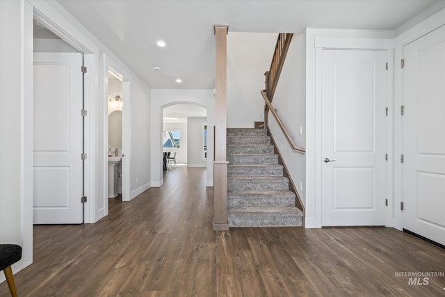 6086 S Sachet Ave, Meridian, ID 83642 - foyer with arched walkways, stairs, recessed lighting, baseboards, and wood finished floors