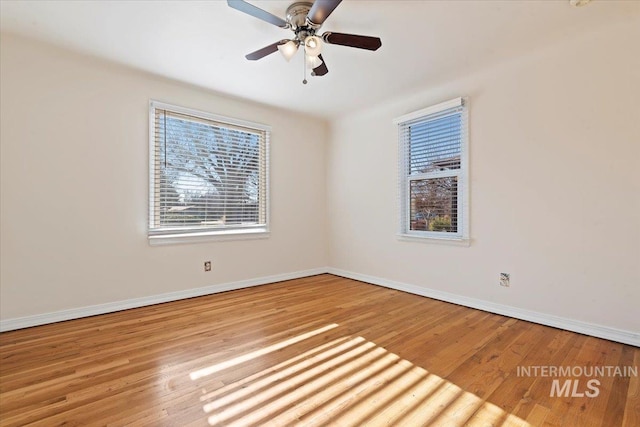 empty room featuring light hardwood / wood-style flooring and ceiling fan