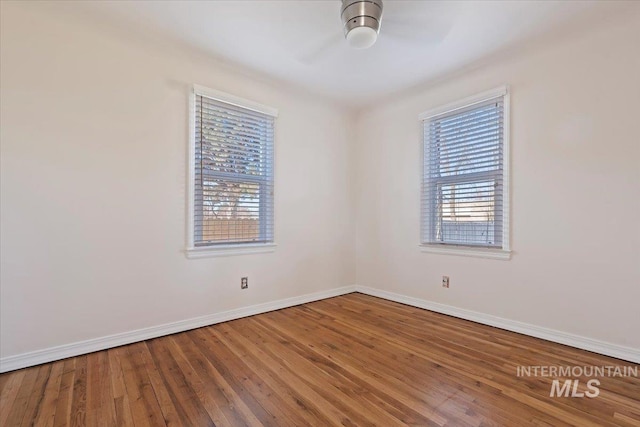 spare room with hardwood / wood-style flooring