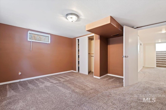 unfurnished bedroom featuring carpet floors and a closet