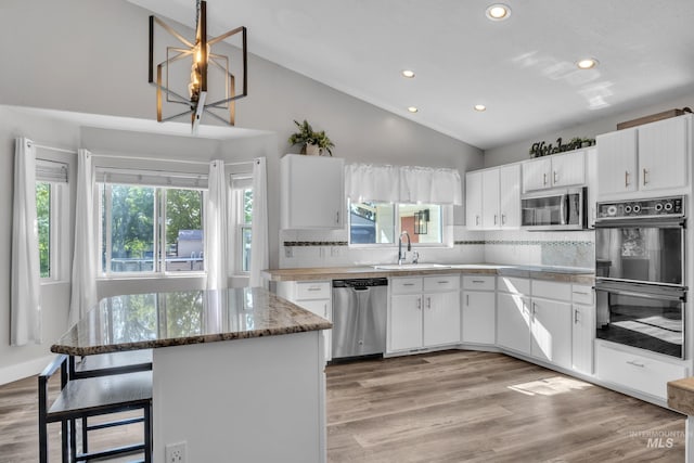 8466 W Idaho Blvd, Letha, ID 83636 - kitchen with appliances with stainless steel finishes, a sink, decorative backsplash, recessed lighting, and white cabinets