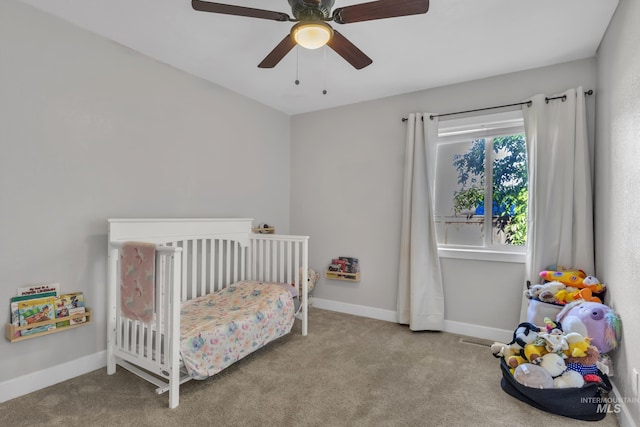 8466 W Idaho Blvd, Letha, ID 83636 - carpeted bedroom featuring a nursery area, baseboards, and a ceiling fan