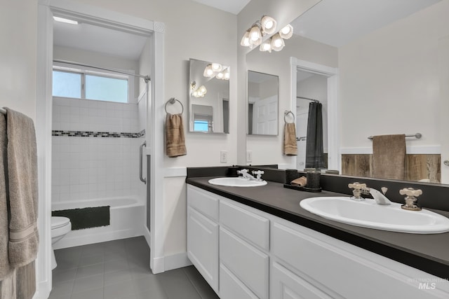 8466 W Idaho Blvd, Letha, ID 83636 - bathroom featuring double vanity, toilet, tile patterned floors, and shower / bathtub combination