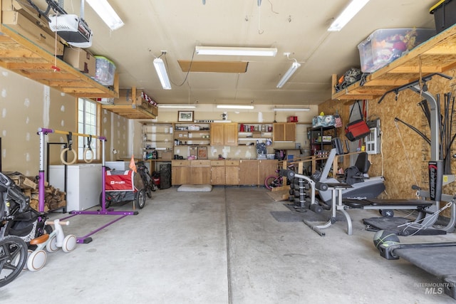 8466 W Idaho Blvd, Letha, ID 83636 - garage featuring a workshop area and a garage door opener