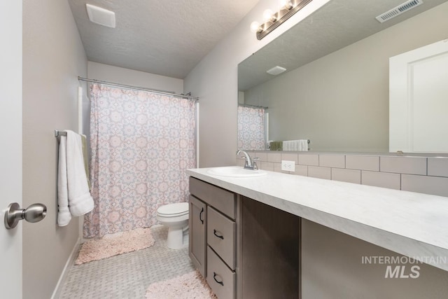 full bath featuring baseboards, visible vents, vanity, and toilet