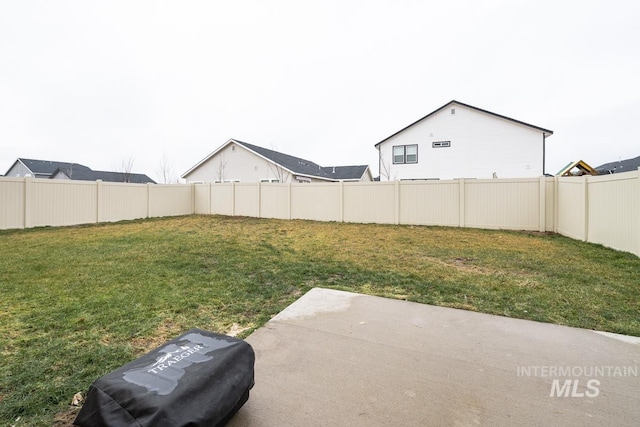 view of yard featuring a fenced backyard and a patio