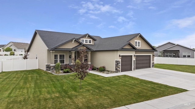 1010 Blueridge Dr, Kimberly, ID 83341 - craftsman inspired home with stone siding, driveway, an attached garage, and roof with shingles