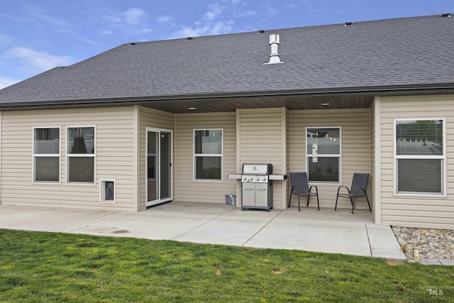 1010 Blueridge Dr, Kimberly, ID 83341 - rear view of house with a shingled roof, a patio area, and a yard