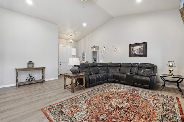 1010 Blueridge Dr, Kimberly, ID 83341 - living room with vaulted ceiling, wood finished floors, arched walkways, and recessed lighting
