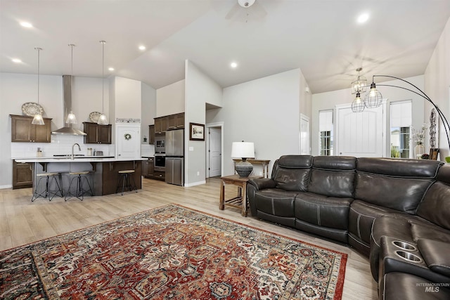 1010 Blueridge Dr, Kimberly, ID 83341 - living area with light wood finished floors, a chandelier, recessed lighting, a ceiling fan, and high vaulted ceiling