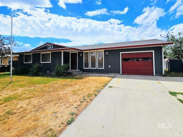 ranch-style house with a front lawn and a garage