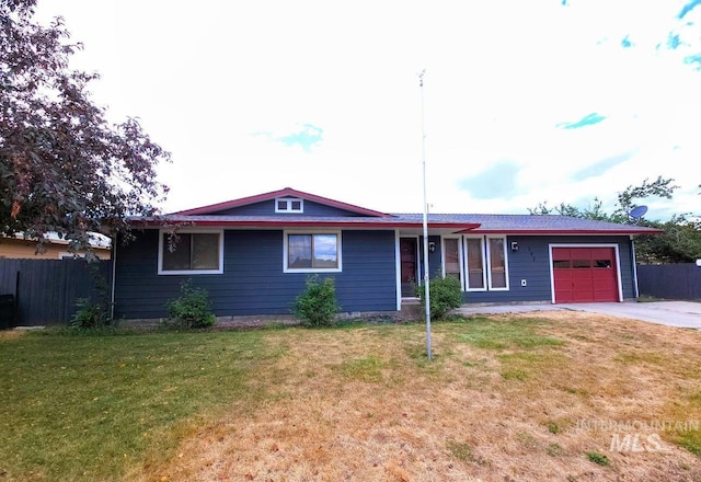 ranch-style house with a garage and a front yard