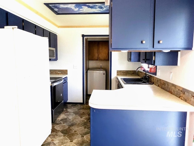 kitchen with blue cabinetry, sink, and stainless steel appliances