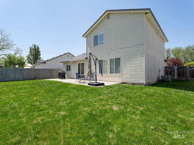 back of property featuring a patio, a fenced backyard, cooling unit, and a lawn