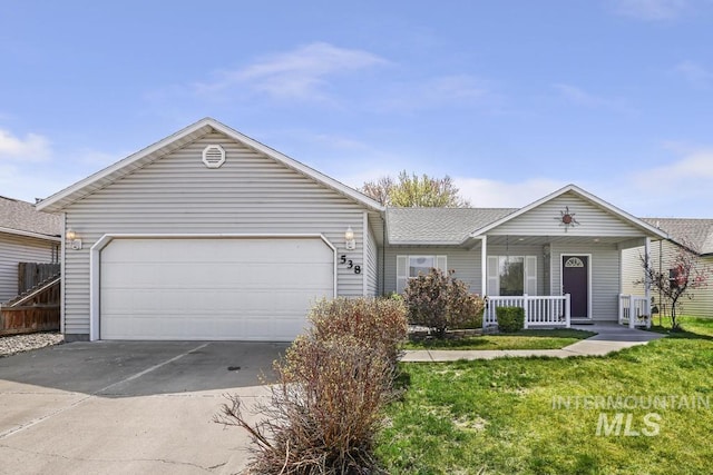 single story home with concrete driveway, a shingled roof, covered porch, an attached garage, and a front yard