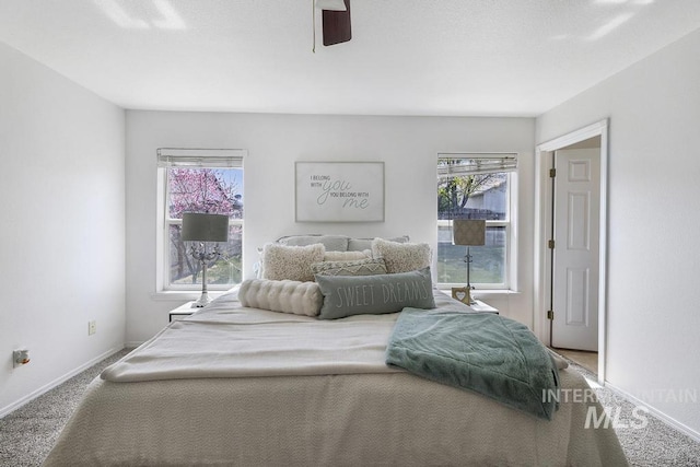 bedroom with carpet, baseboards, and ceiling fan