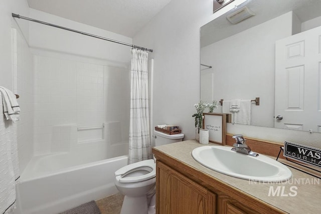 bathroom with tile patterned floors, vanity, shower / bathtub combination with curtain, and toilet