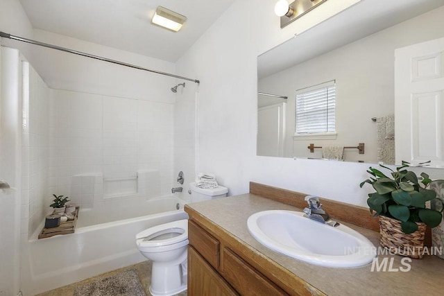 full bath with toilet, vanity, and shower / tub combination