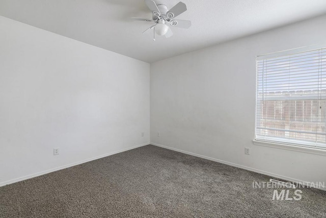 empty room featuring a ceiling fan, baseboards, and carpet floors