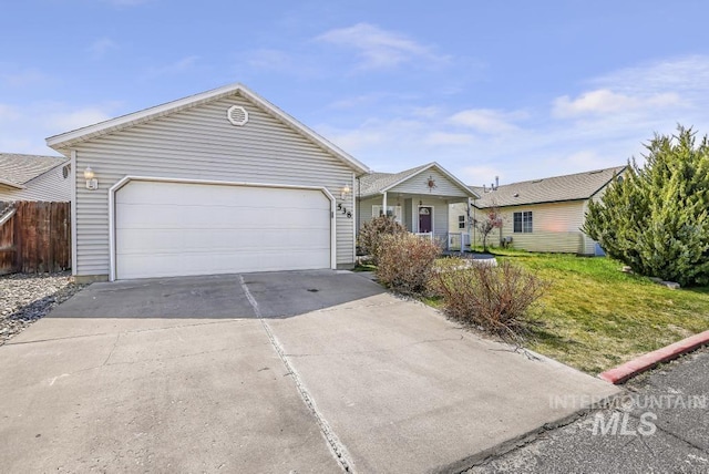 single story home featuring concrete driveway, fence, a front yard, and a garage