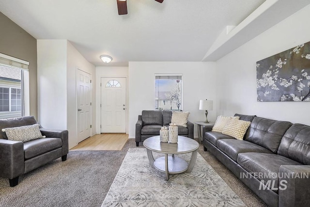 living room with carpet flooring and ceiling fan
