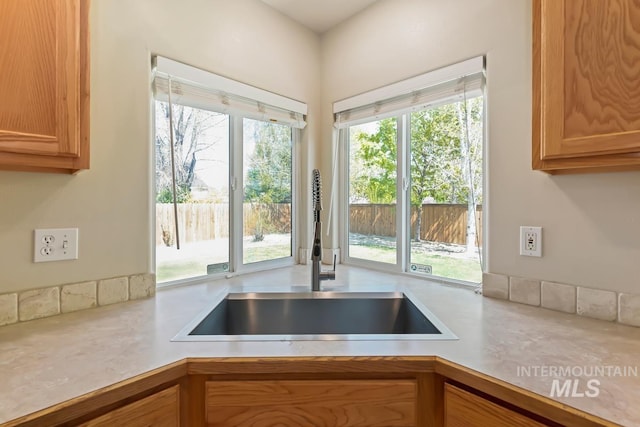7362 S Shadowmoss Ave, Boise, ID 83709 - kitchen featuring a sink and light countertops