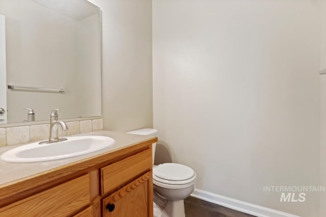 7362 S Shadowmoss Ave, Boise, ID 83709 - half bath with toilet, vanity, and baseboards
