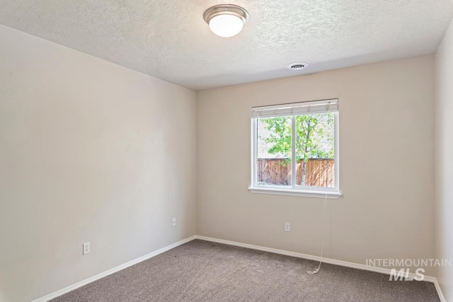7362 S Shadowmoss Ave, Boise, ID 83709 - carpeted spare room with a textured ceiling and baseboards